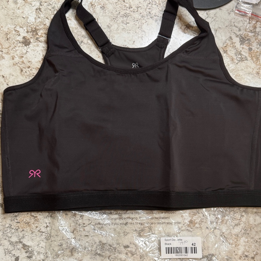 Ruby Ribbon Black Sports Bra with Pink Logo